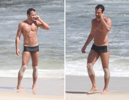 Malvino Salvador exibe barriga sarada na praia.  (Foto: AgNews)